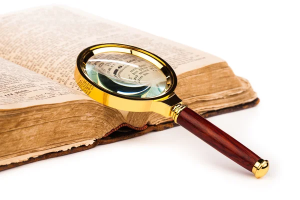 Old book and magnifying glass isolated on white — Stock Photo, Image