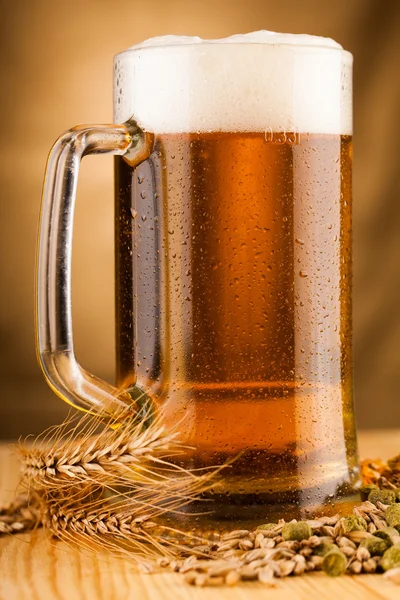 Glass of light beer on table — Stock Photo, Image