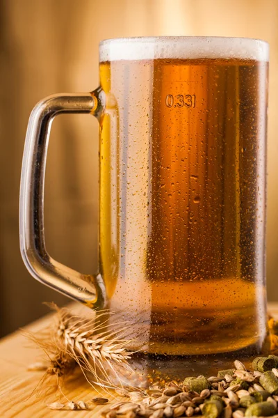 Glass of light beer on table — Stock Photo, Image