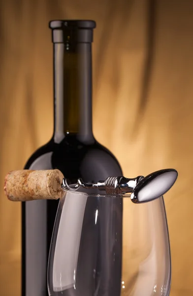 Corkscrew glass and wine bottle — Stock Photo, Image