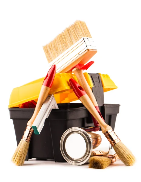 Can of paint with paintbrushes and toolbox isolated on white — Stock Photo, Image