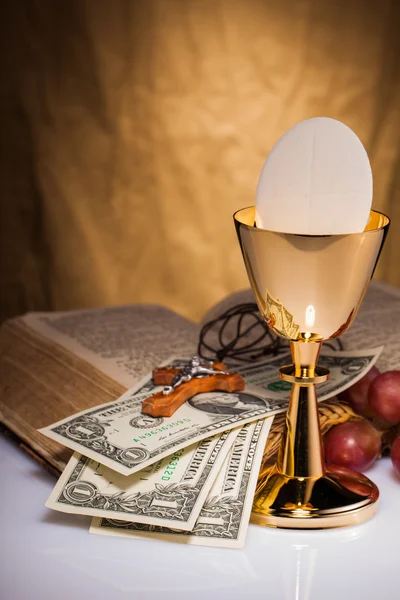 Holy communion and dollar bill — Stock Photo, Image