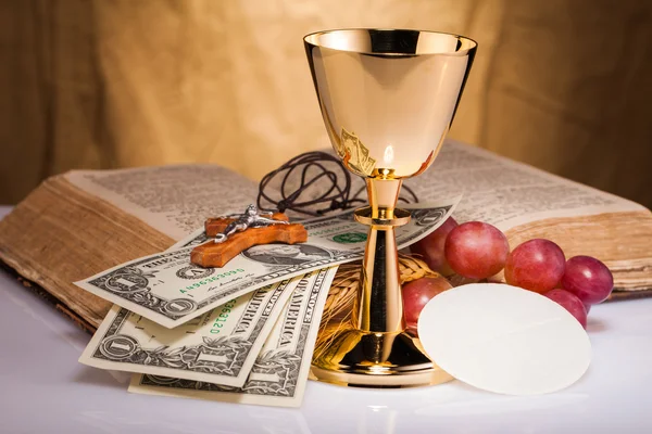 Holy communion and dollar bill — Stock Photo, Image