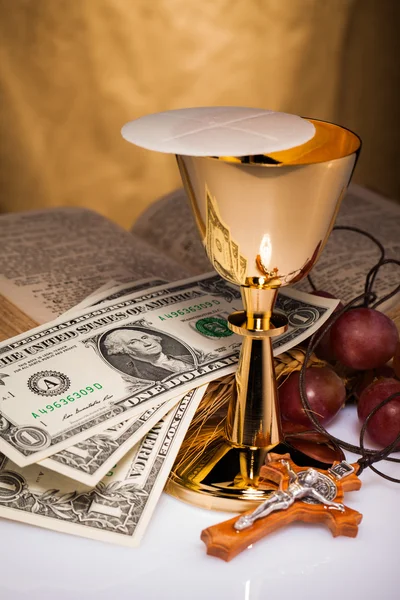 Holy communion and dollar bill — Stock Photo, Image