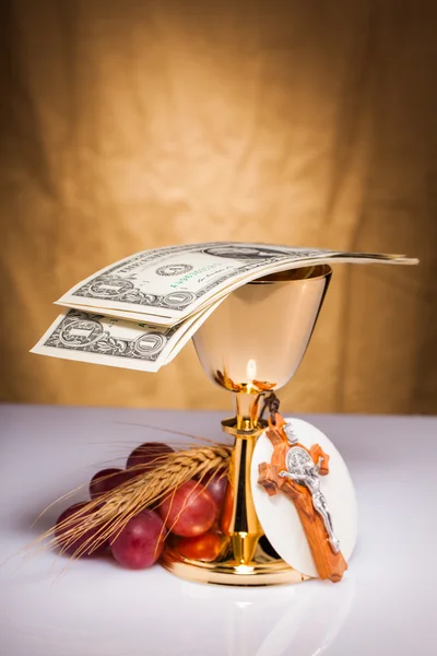 Holy communion and dollar bill — Stock Photo, Image