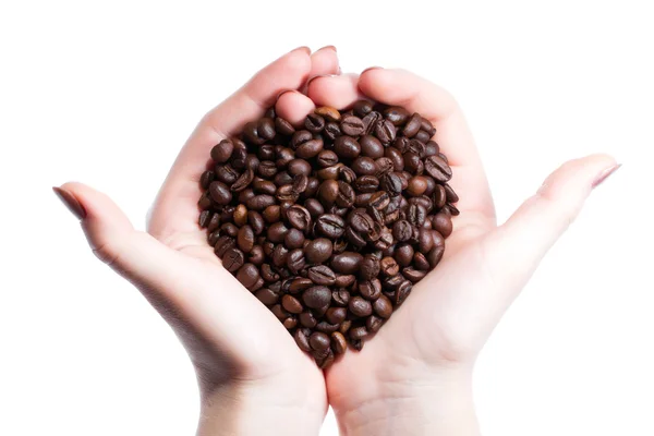 Copo com café e mão sobre fundo grãos de café — Fotografia de Stock