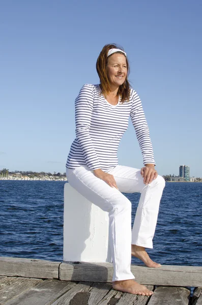 Beautiful happy mature woman marine background — Stock Photo, Image
