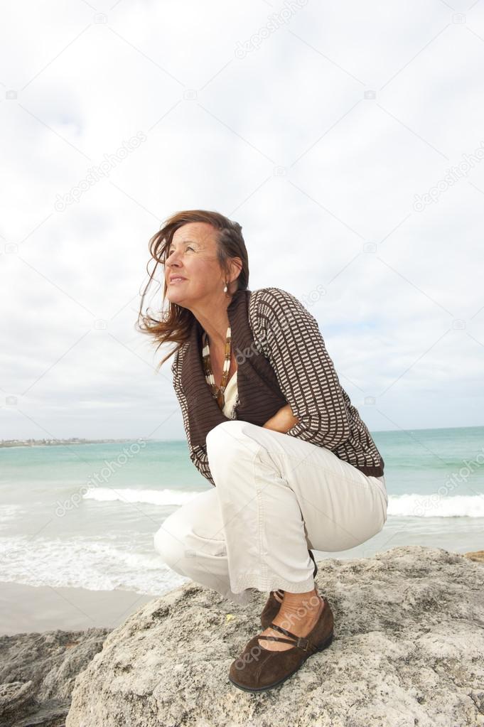 Mature woman ocean background