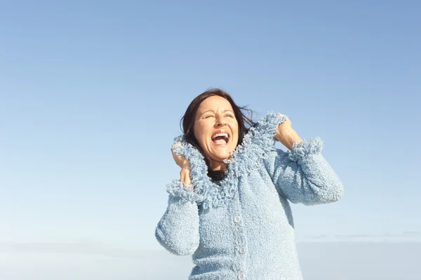 Happy woman winter sky isolated — Stock Photo, Image