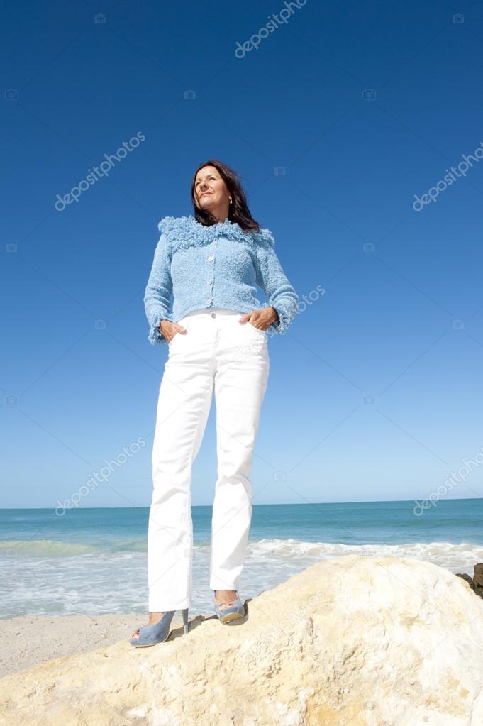 Sexy mature lady ocean background
