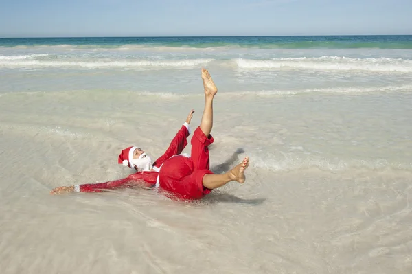 Feliz feriado na praia de Papai Noel — Fotografia de Stock