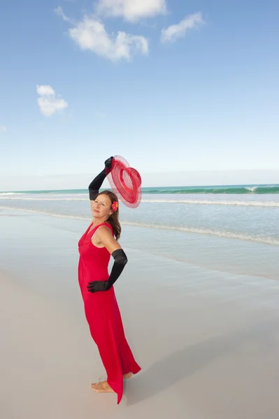 Sexy woman red dress beach I — Stock Photo, Image