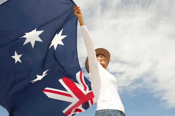 Akubra 帽子和澳大利亚国旗的女人 免版税图库照片