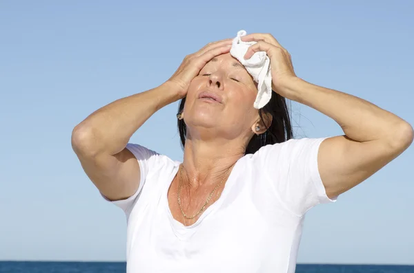 Mature woman exhausted stress sweating — Stock Photo, Image