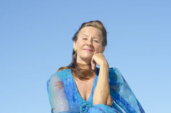 Portrait elegant mature woman isolated sky — Stock Photo, Image
