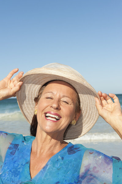 Portrait happy mature lady isolated sky