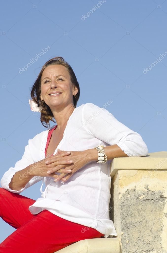 Sexy relaxed mature woman isolated outdoor