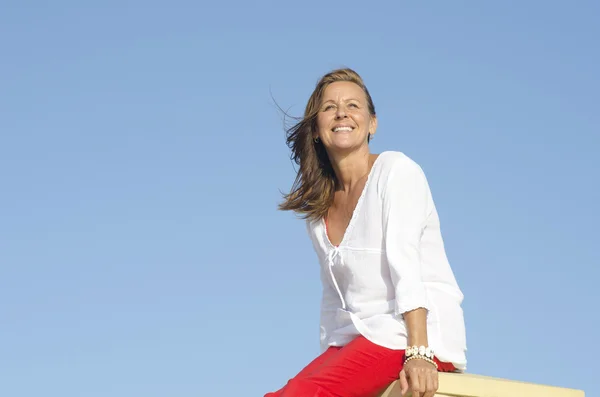 Confident relaxed mature woman outdoor — Stock Photo, Image