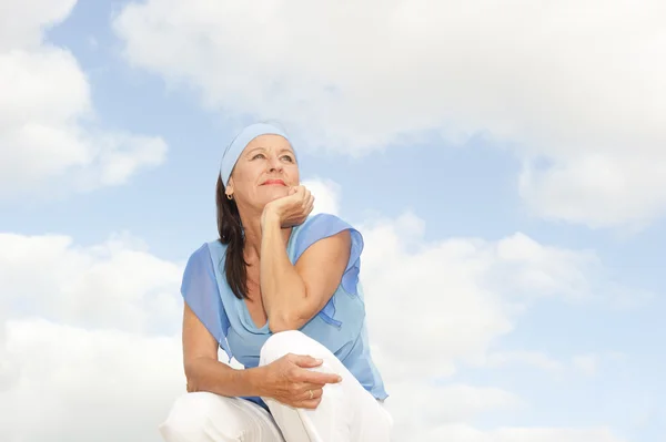 Happy thoughtful middle aged woman outdoor — Stock Photo, Image