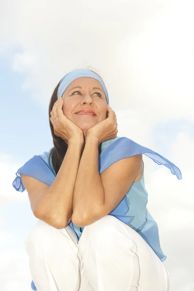 Happy thoughtful middle aged woman outdoor — Stock Photo, Image