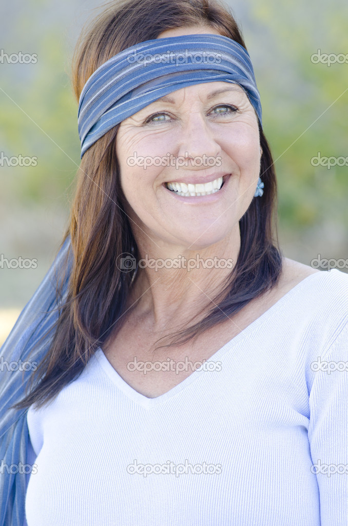 Portrait attractive happy mature woman outdoor