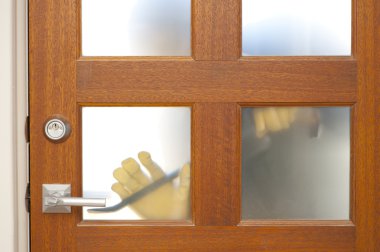 Burglar housebreaking security door clipart