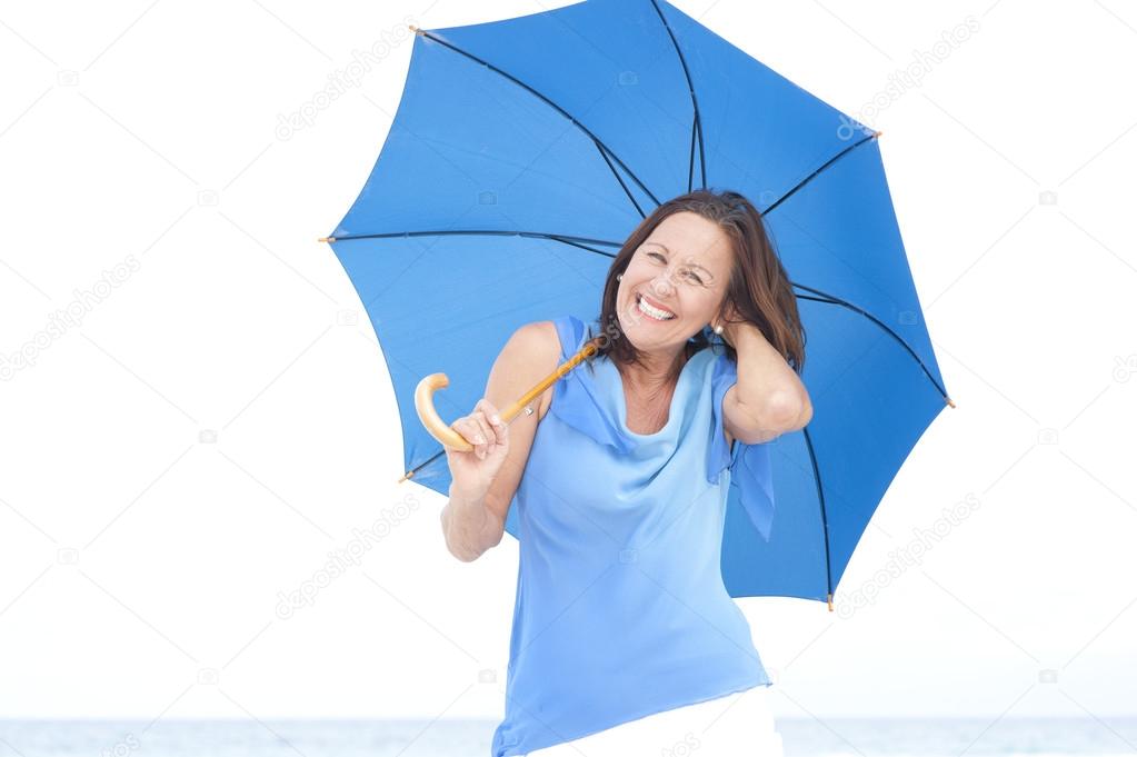 Funny attractive mature woman blue umbrella