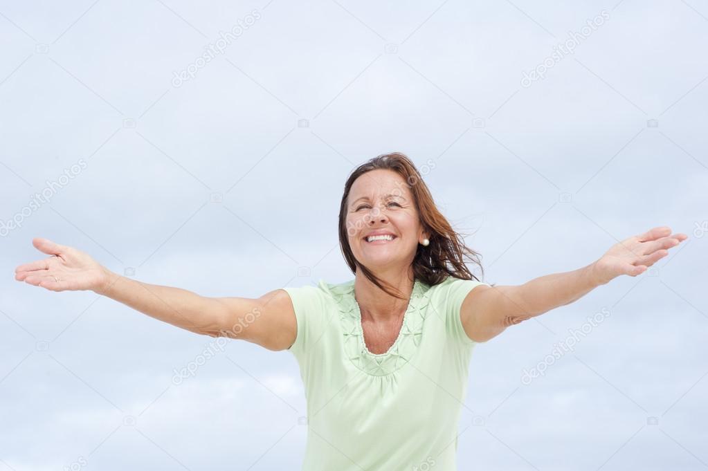 Positive mature woman open arms