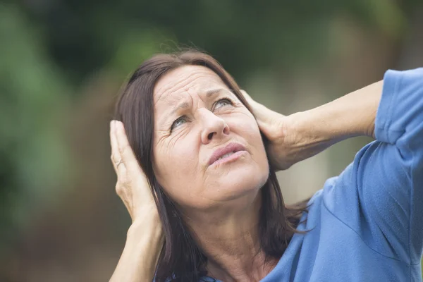 Stressed mature woman angry outdoor — Stock Photo, Image