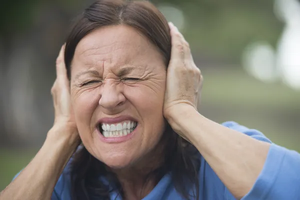Upset stressed mature woman outdoor — Stock Photo, Image