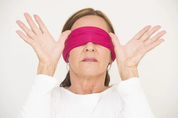 Attractive mature woman blindfolded — Stock Photo, Image