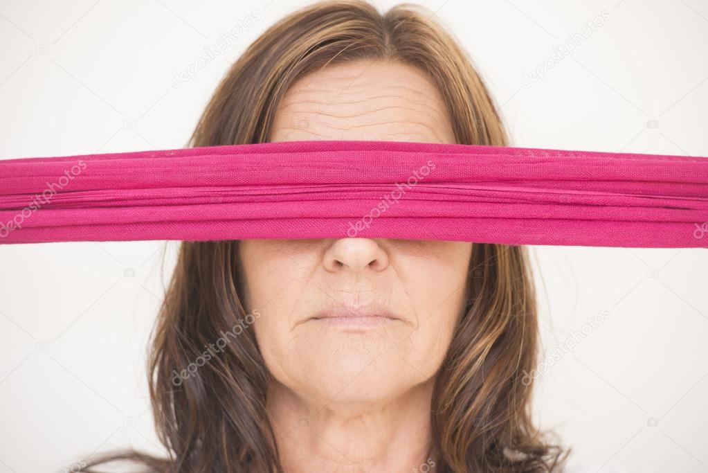 Portrait middle aged woman with blindfold