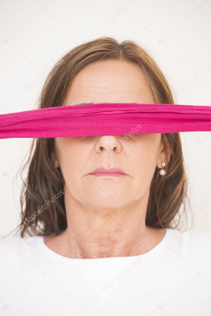 Portrait mature woman blindfolded