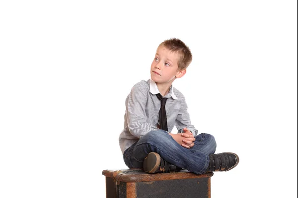 Young boy sat cross-legged — Stock Photo, Image