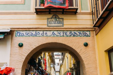 Granada, Spain - December 28, 2021: Alcaiceria market known as the Grand Bazaar of Granada represents the original Moorish market of silk, spices and other valuable goods.