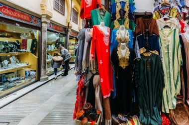 Granada, Spain - December 28, 2021: Alcaiceria market known as the Grand Bazaar of Granada represents the original Moorish market of silk, spices and other valuable goods.