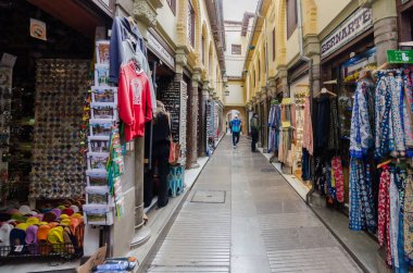 Granada, Spain - December 28, 2021: Alcaiceria market known as the Grand Bazaar of Granada represents the original Moorish market of silk, spices and other valuable goods.