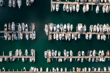 Aerial top down drone view of many luxurious yachts moored in marina in Cascais, Portugal