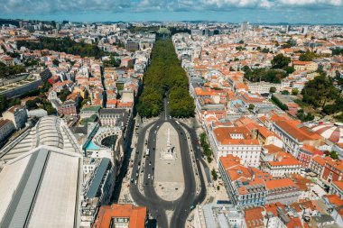 Aerial drone view of Restauradores square looking north towards Avenida da Liberdade in Lisbon, Portugal towards Marques de Pombal roundabout