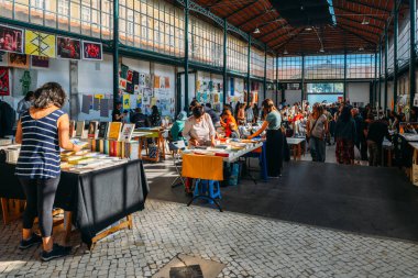 Lisbon, Portugal - October 1st, 2022: View of Lisbon's iconic Ladra open flea market in the Alfama district every Tuesday and Saturday clipart