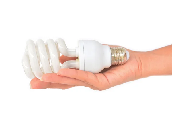 Mãos segurando lâmpadas tradicionais e energeticamente eficazes — Fotografia de Stock