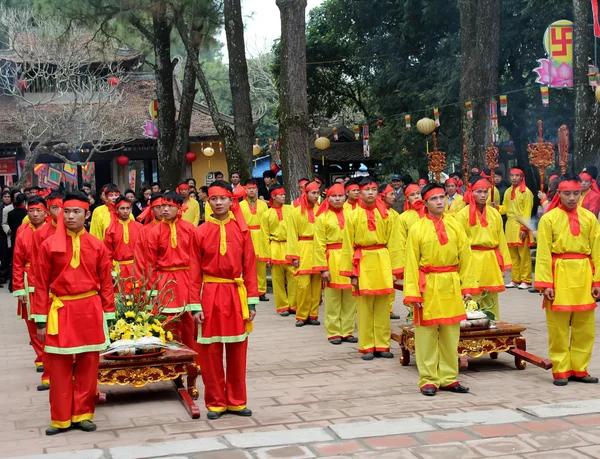 Group of people in traditional costume give gifts to the holy — Stock Photo, Image