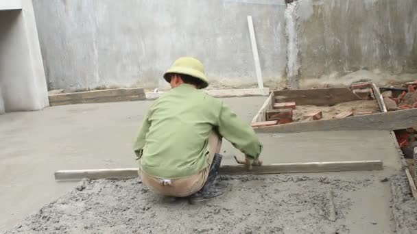 Construction worker mixing concrete — Stock Video