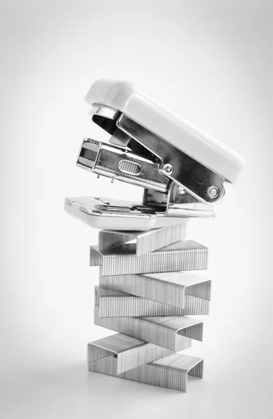 Pink stapler with staples stack — Stock Photo, Image