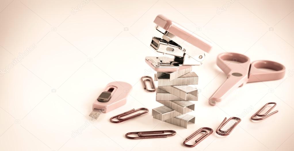 Pink stapler with office accessories