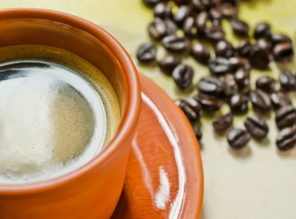 Coffee cup and coffee beans — Stock Photo, Image