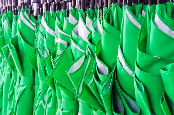 Stack of green umbrellas — Stock Photo, Image