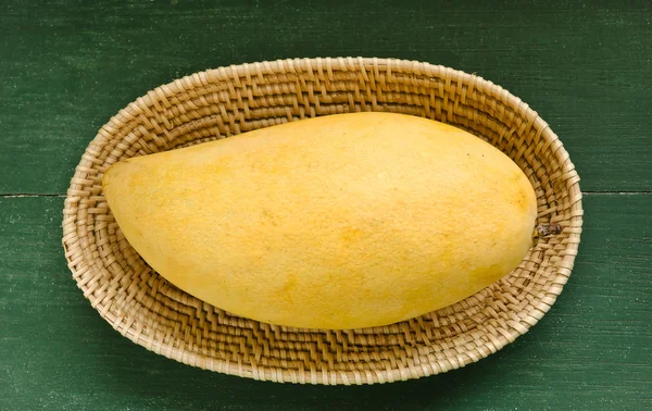 Fresh golden mango in basket — Stock Photo, Image