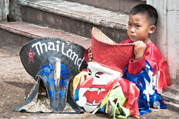 An unidentified child aged 7 years wear ghost costumes