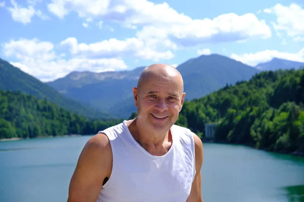 Mature Man Years Old Stands Smiles Backdrop Lake Achensee Austria — Stock Photo, Image
